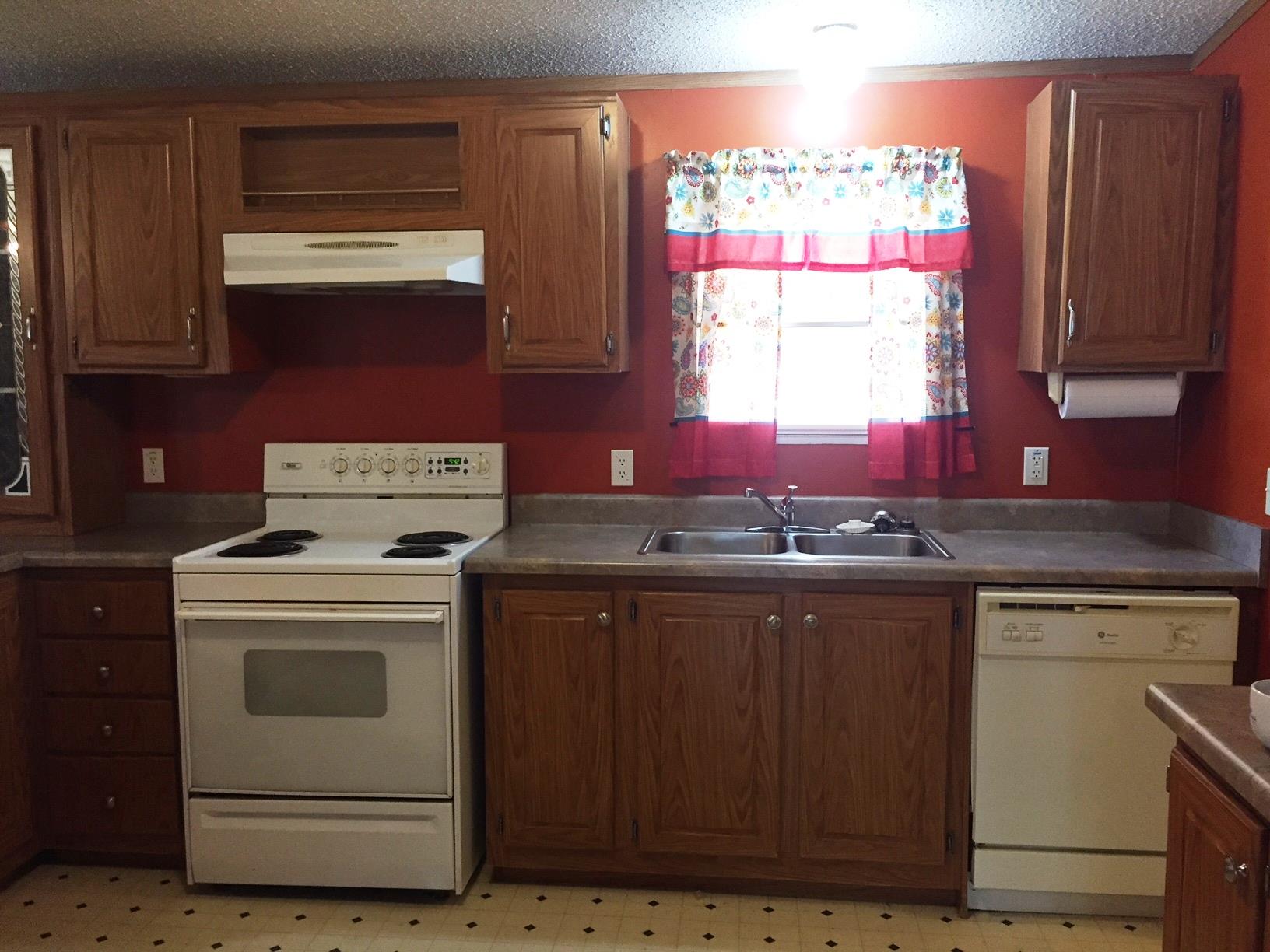 10 Railroad Road Elora, TN 37328 - Photo 6 of 19 a kitchen with granite countertop a sink stove and cabinets