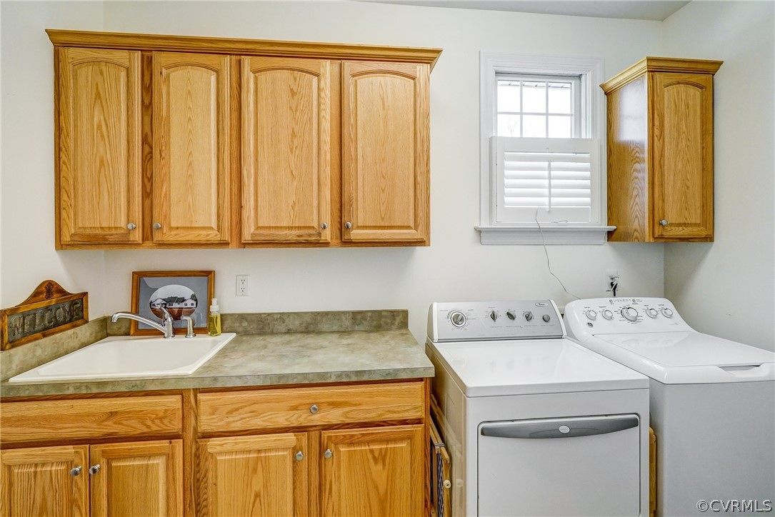 3982 County Line Road Kents Store, VA 23084 - Photo 26 of 49 a utility room with sink dryer and washer