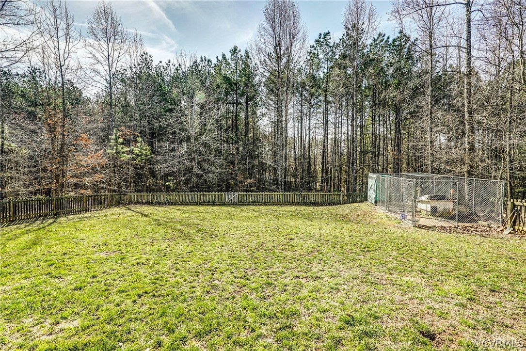 3982 County Line Road Kents Store, VA 23084 - Photo 42 of 49 a view of swimming pool with lawn chairs and large trees