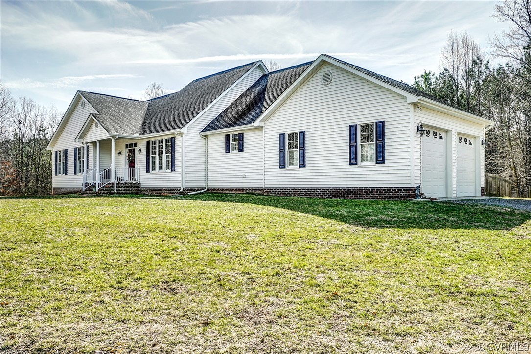 3982 County Line Road Kents Store, VA 23084 - Photo 48 of 49 a front view of a house with garden
