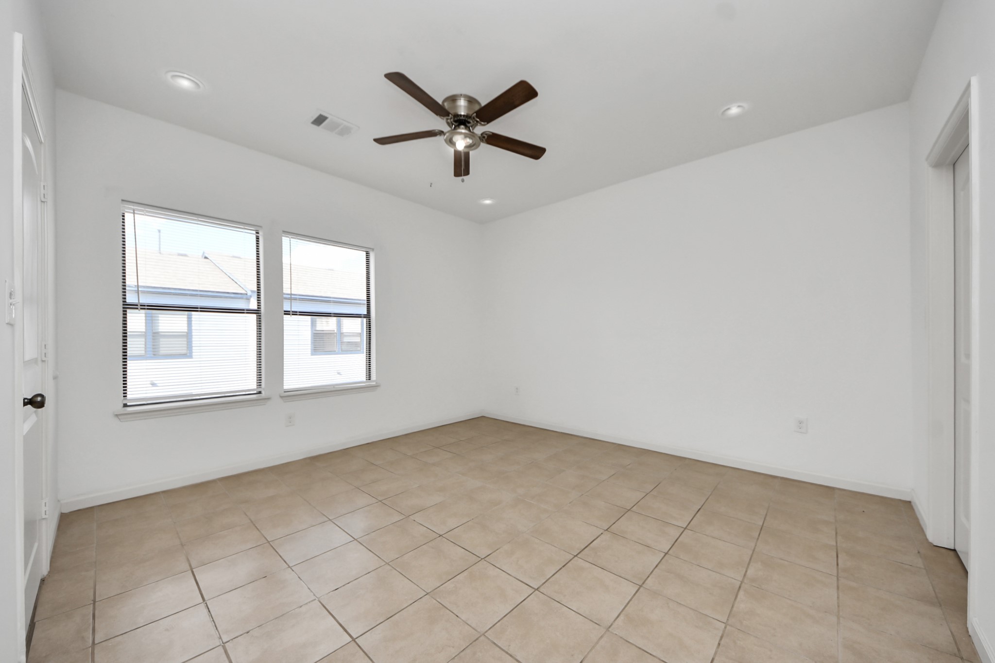 4327 Oak Ridge Drive, Unit A Pasadena, TX 77503 - Photo 8 of 20 an empty room with windows and fan