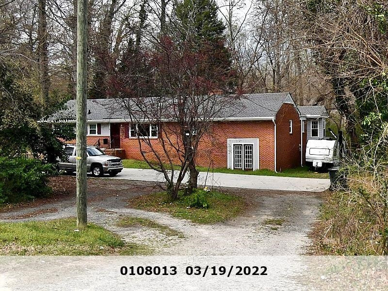 3025 Poole Road Raleigh, NC 27610 - Photo 1 of 3 a front view of a house with a yard and garage
