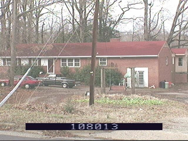 3025 Poole Road Raleigh, NC 27610 - Photo 3 of 3 a view of a house with a yard