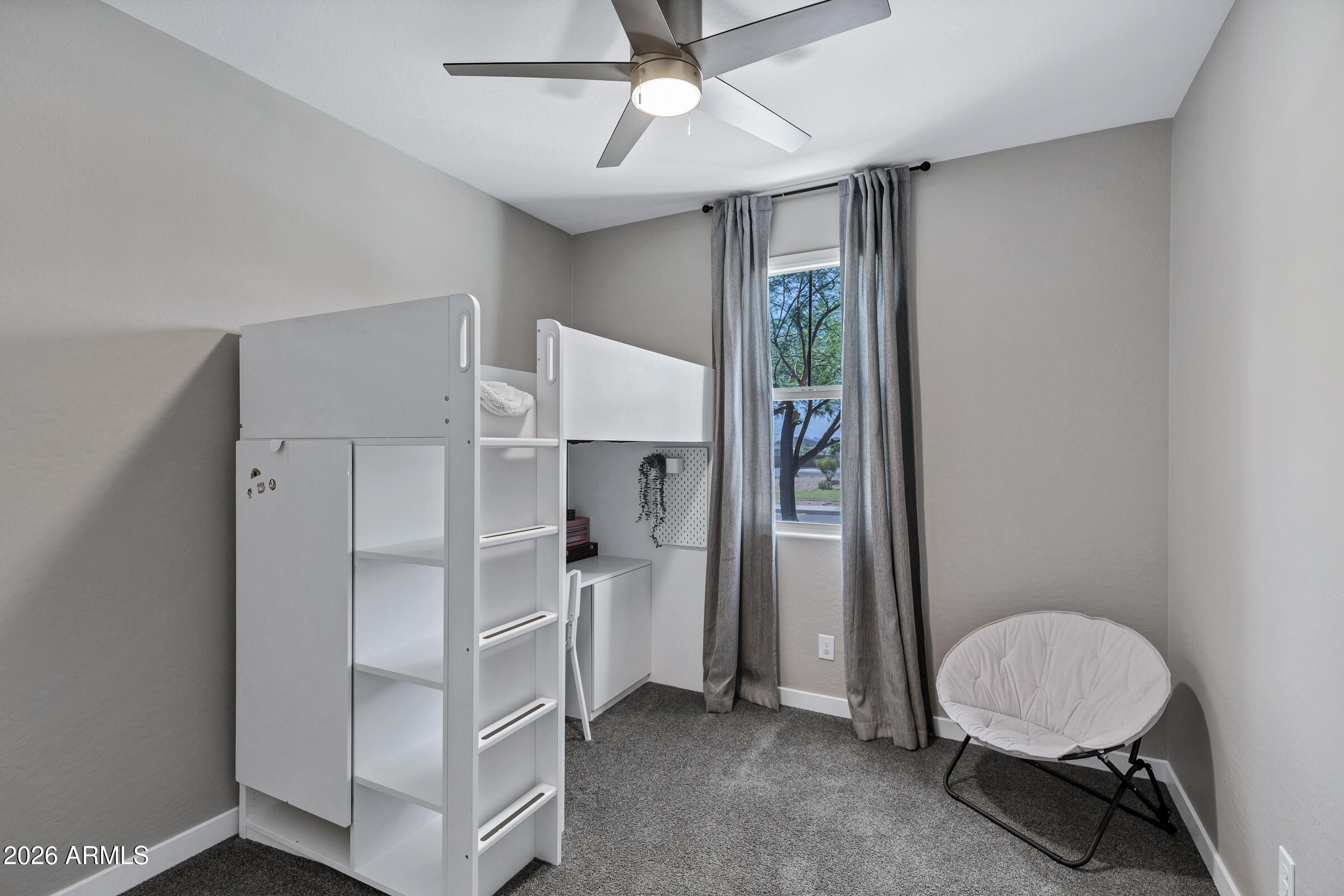 12243 East Sereno Road Gold Canyon, AZ 85118 - Photo 23 of 37 a room with a bed and a chandelier