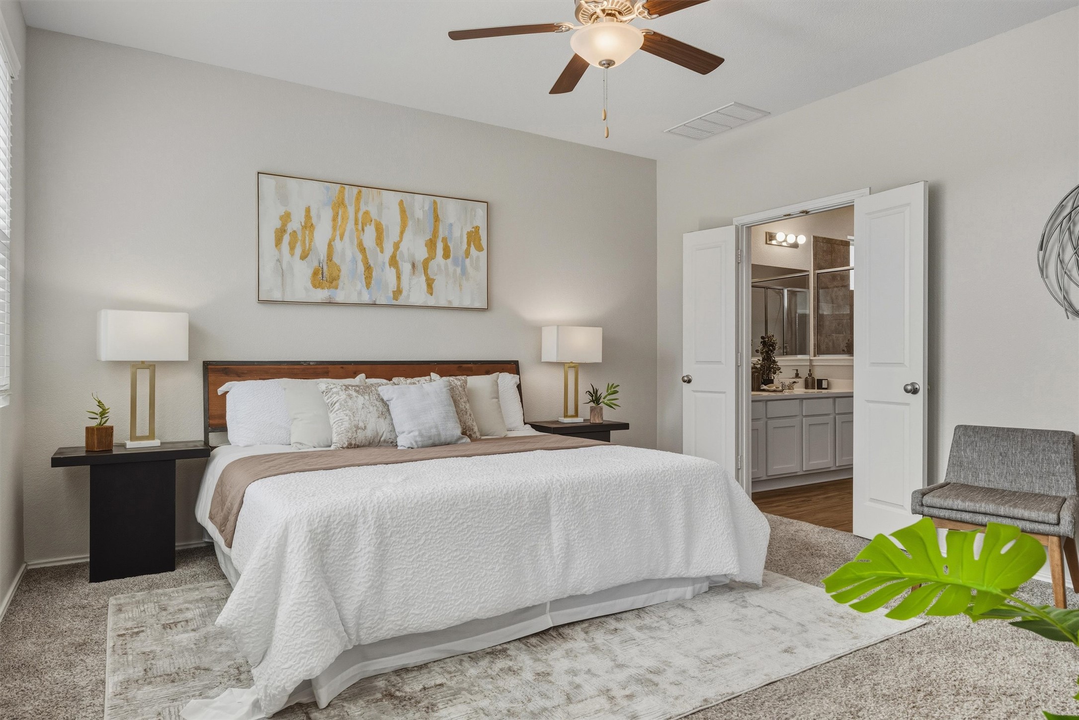 316 Montauk Loop Georgetown, TX 78628 - Photo 8 of 32 Bedroom featuring a ceiling fan and ensuite bath