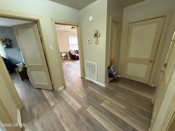 a kitchen with a stove and white cabinets
