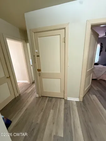 a kitchen with a stove sink and cabinets