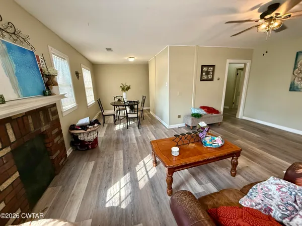 a bed room with two bed and a flat tv screen