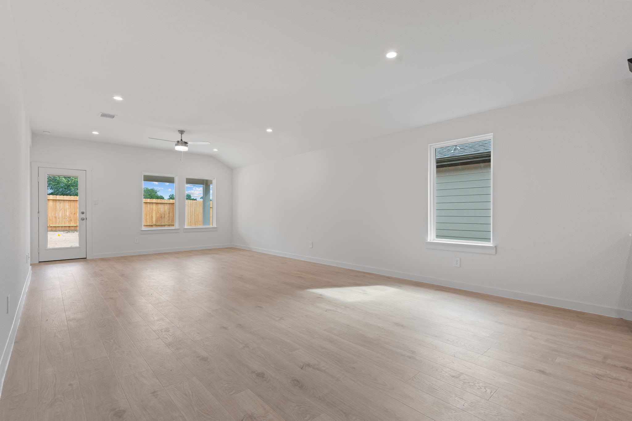 1603 Cinque Terre Way Richmond, TX 77406 - Photo 17 of 31 an empty room with windows and entrance