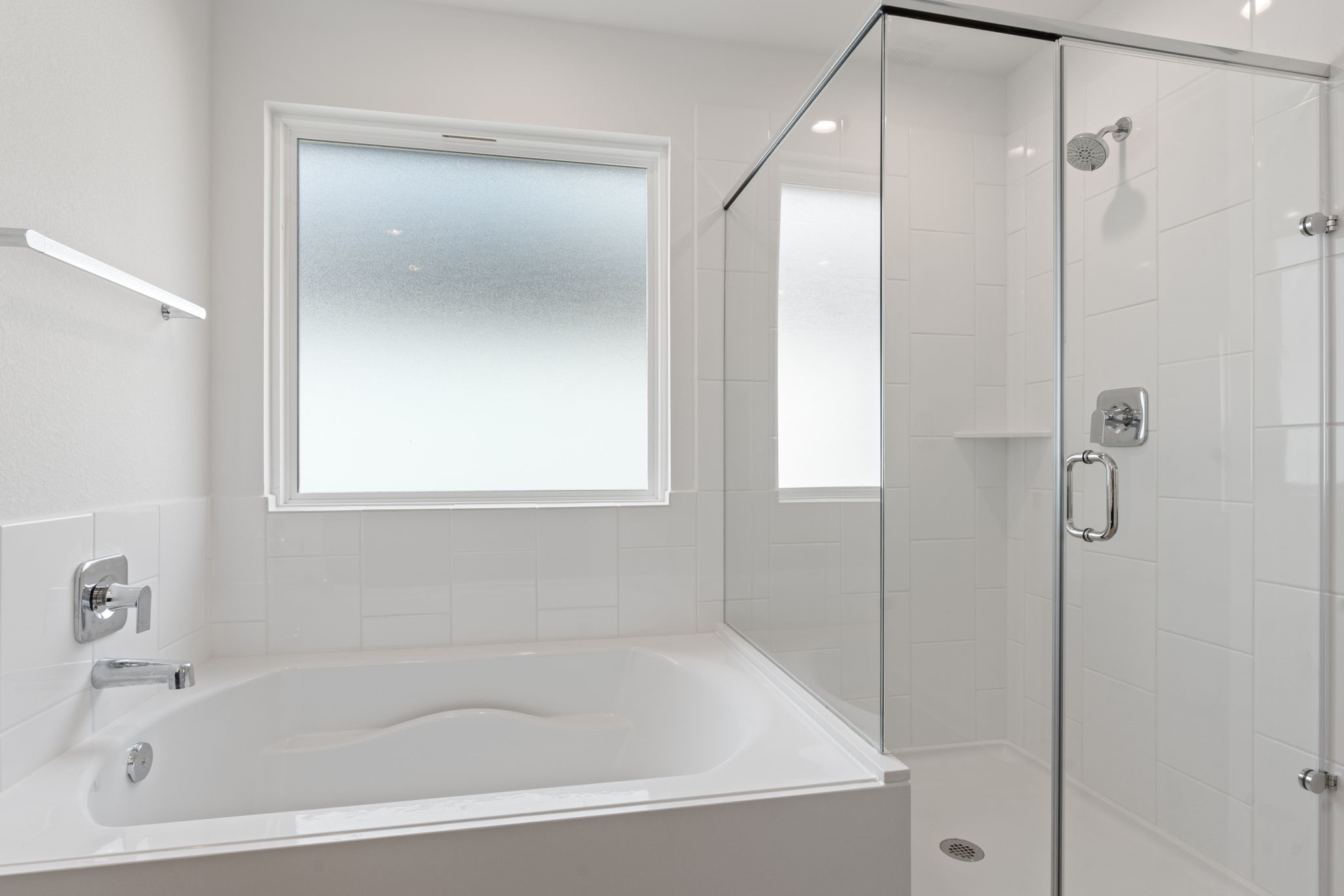 1603 Cinque Terre Way Richmond, TX 77406 - Photo 27 of 31 a white bath tub sitting next to a shower