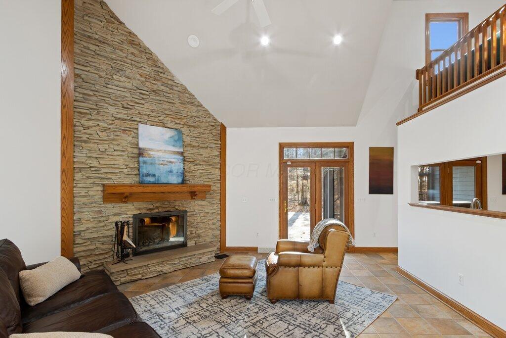 7498 Ruffner Road Northeast Baltimore, OH 43105 - Photo 20 of 64 Living Room has direct access the to deck.