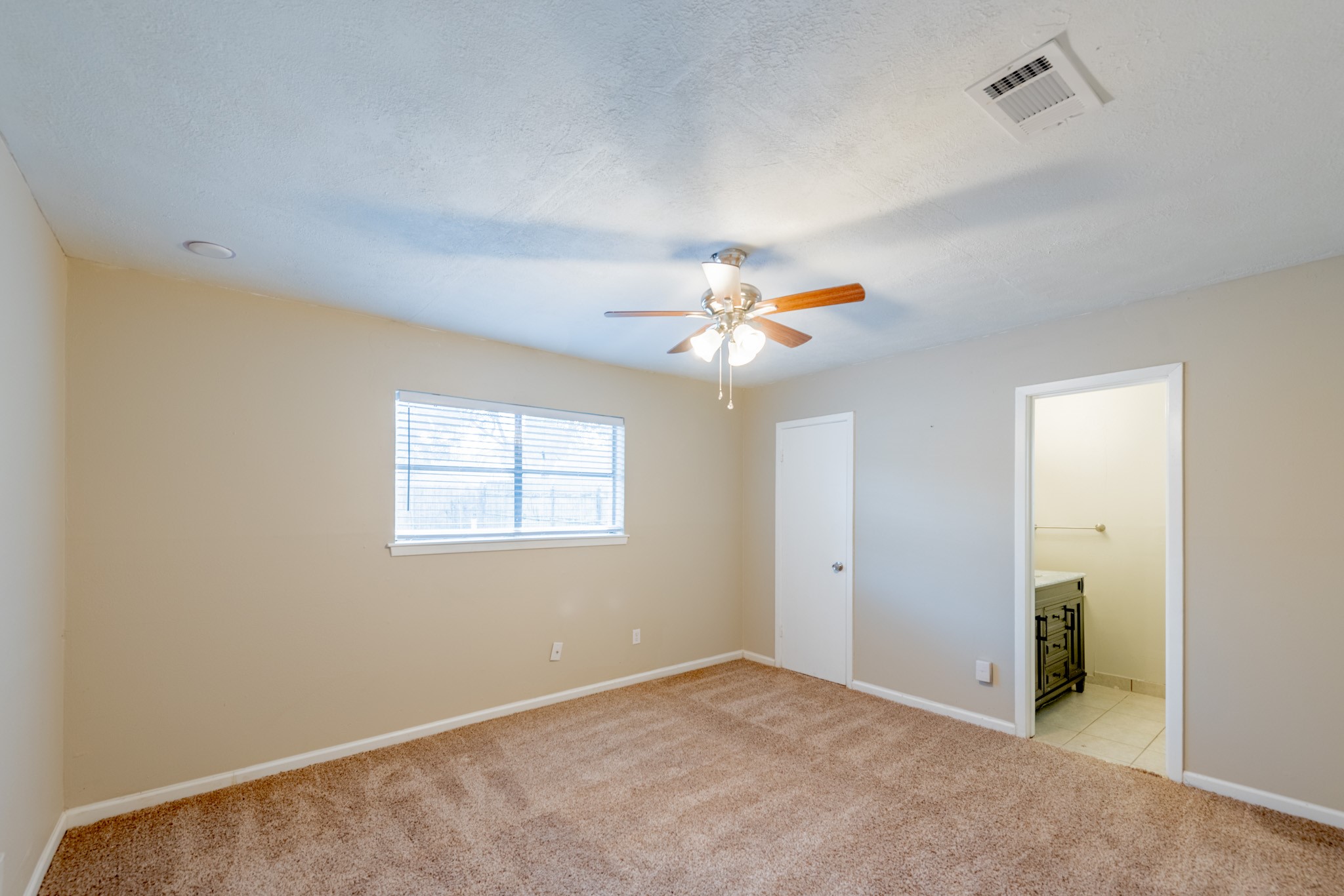 10823 Overlea Drive Houston, TX 77089 - Photo 15 of 36 an empty room with windows and fan