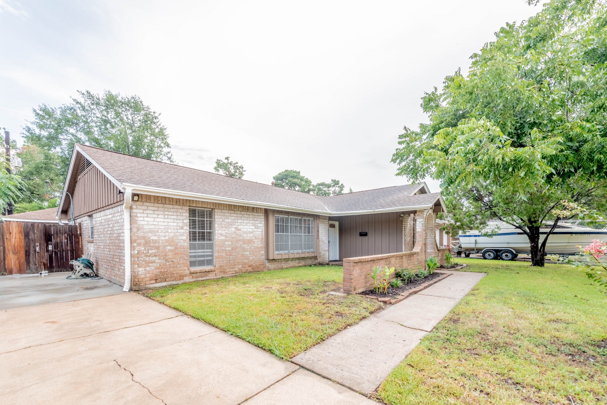 10823 Overlea Drive Houston, TX 77089 - Photo 2 of 36 a front view of house with yard outdoor seating and barbeque oven