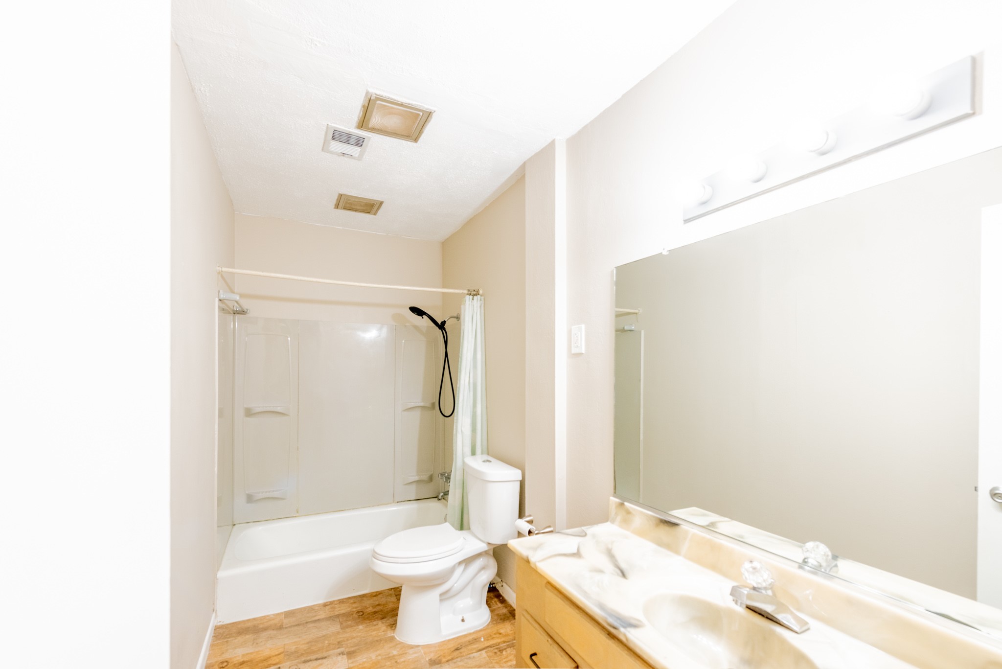 10823 Overlea Drive Houston, TX 77089 - Photo 24 of 36 a bathroom with a granite countertop sink toilet a mirror and shower