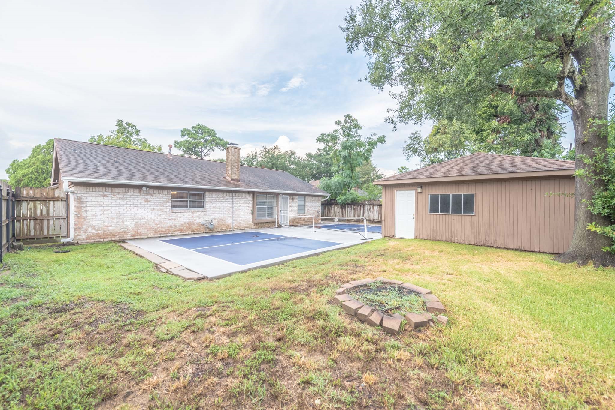 10823 Overlea Drive Houston, TX 77089 - Photo 25 of 36 a view of a house with pool and a yard