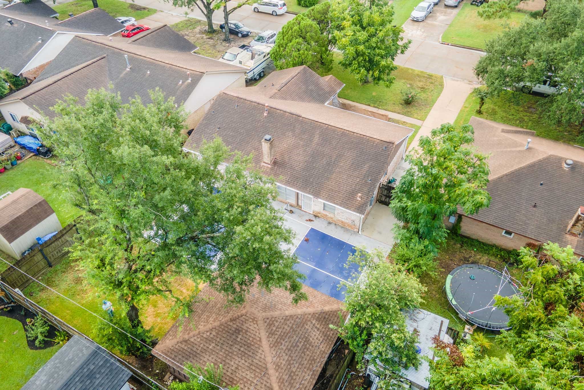 10823 Overlea Drive Houston, TX 77089 - Photo 32 of 36 an aerial view of a house with garden space and a street view