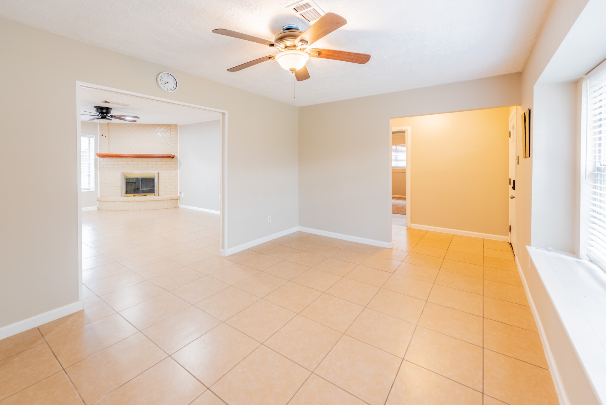 10823 Overlea Drive Houston, TX 77089 - Photo 7 of 36 a view of an empty room with cabinet and a chandelier fan