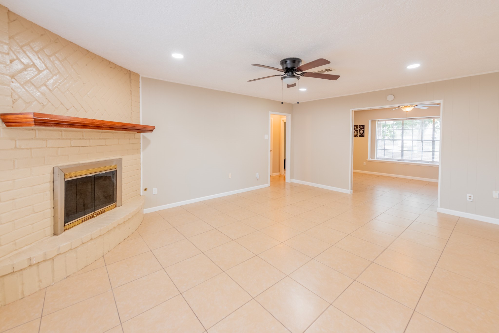 10823 Overlea Drive Houston, TX 77089 - Photo 10 of 36 a view of an empty room with a fireplace