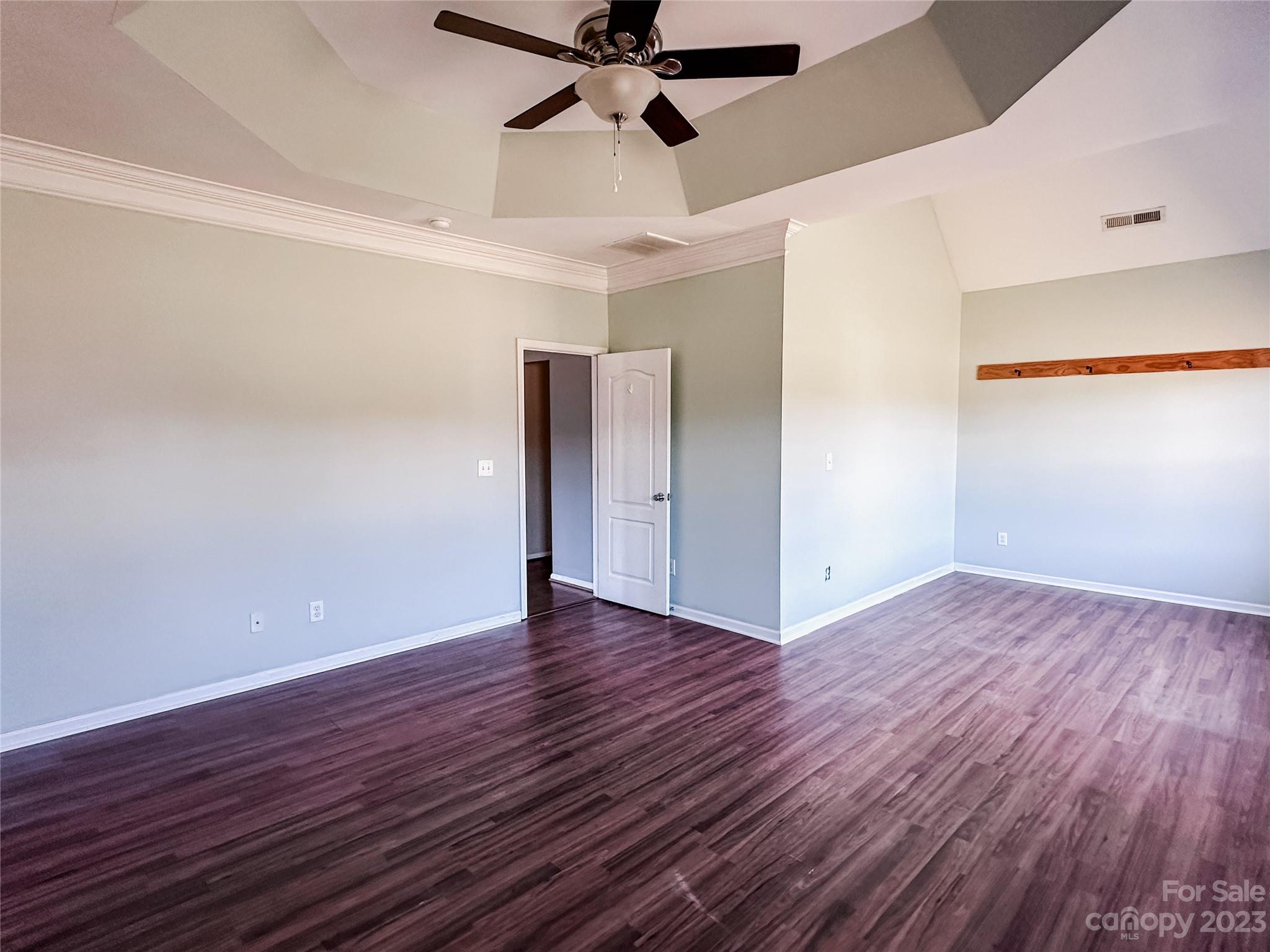 181 Weathers Creek Road Troutman, NC 28166 - Photo 13 of 25 a view of an empty room and wooden floor
