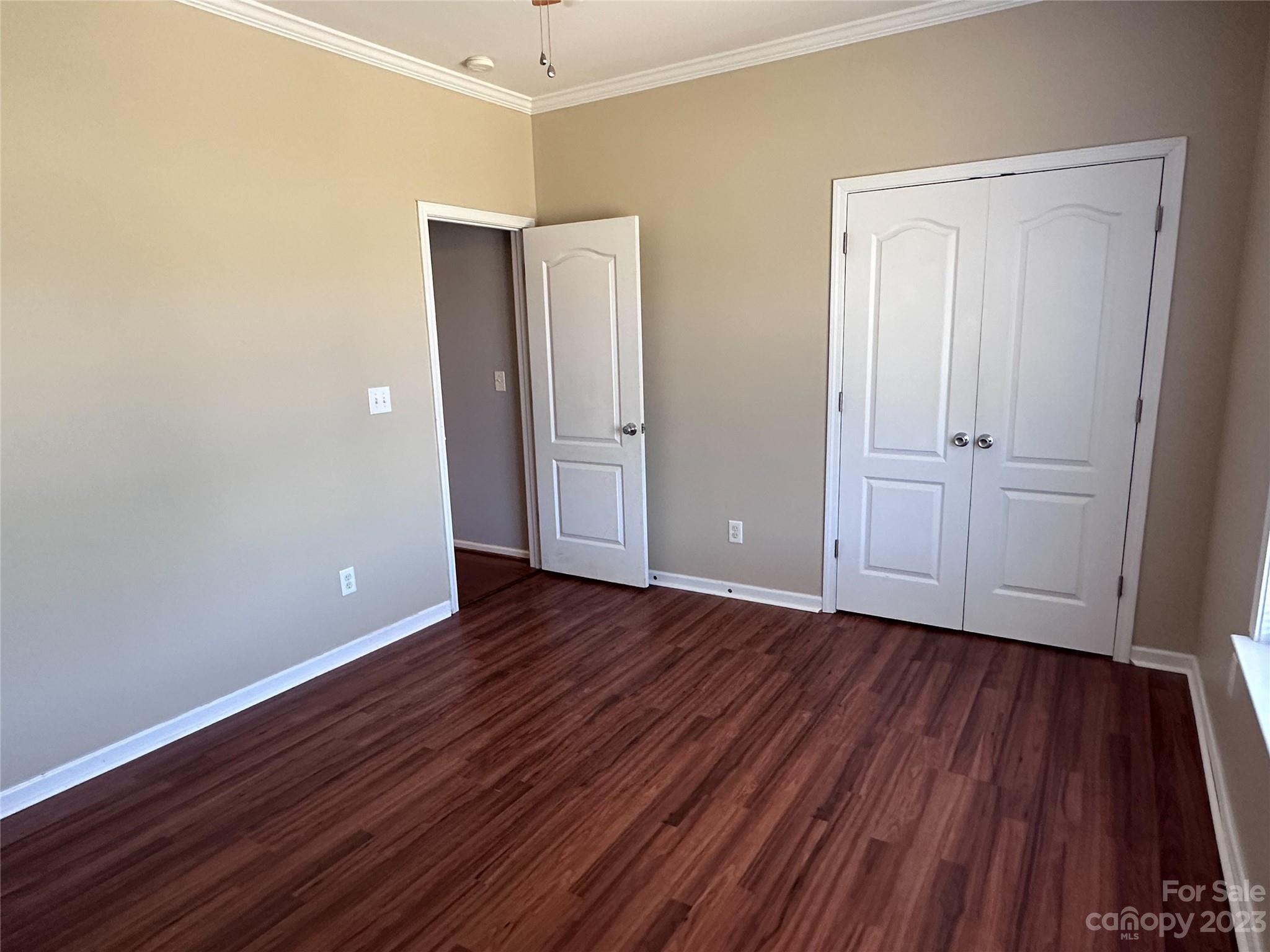 181 Weathers Creek Road Troutman, NC 28166 - Photo 20 of 25 a view of an empty room with wooden floor and closet