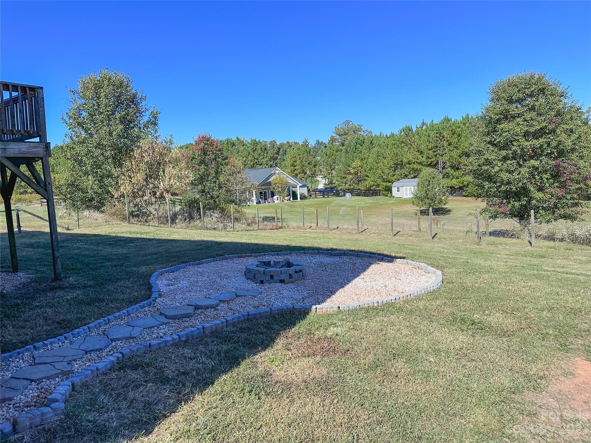 181 Weathers Creek Road Troutman, NC 28166 - Photo 25 of 25 a view of a yard with an outdoor space