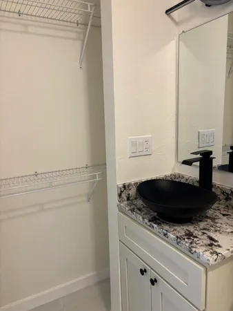 a white toilet sitting next to a shower