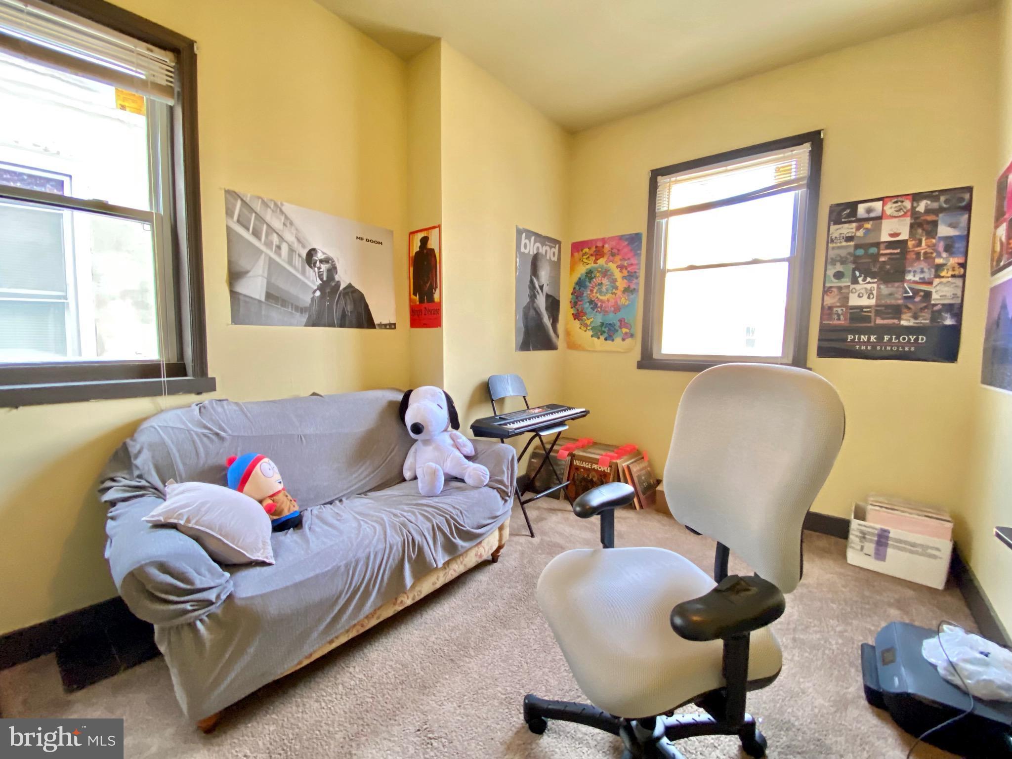 1435 West Norris Street, Unit B Philadelphia, PA 19121 - Photo 11 of 24 a living room with furniture and a window