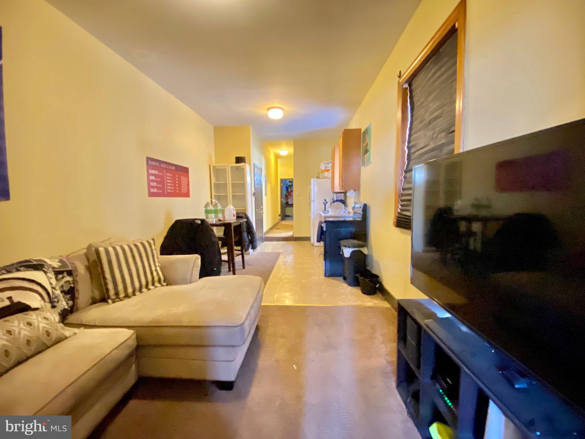 1435 West Norris Street, Unit B Philadelphia, PA 19121 - Photo 5 of 24 a living room with furniture and a couch