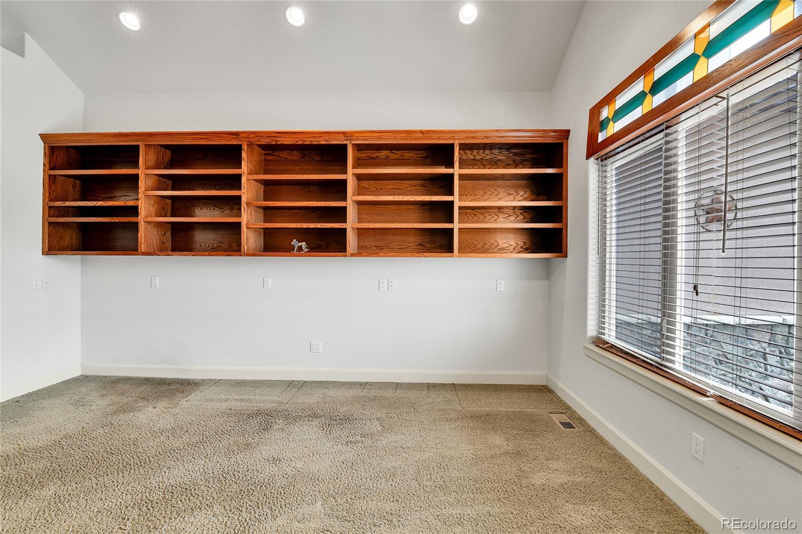 12984 Crowfoot Springs Road Franktown, CO 80116 - Photo 17 of 50 a view of wooden floor and windows in a room