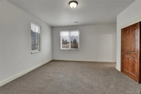 an empty room with sliding door