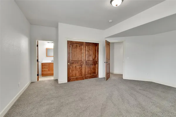 a room with walk in closet and window