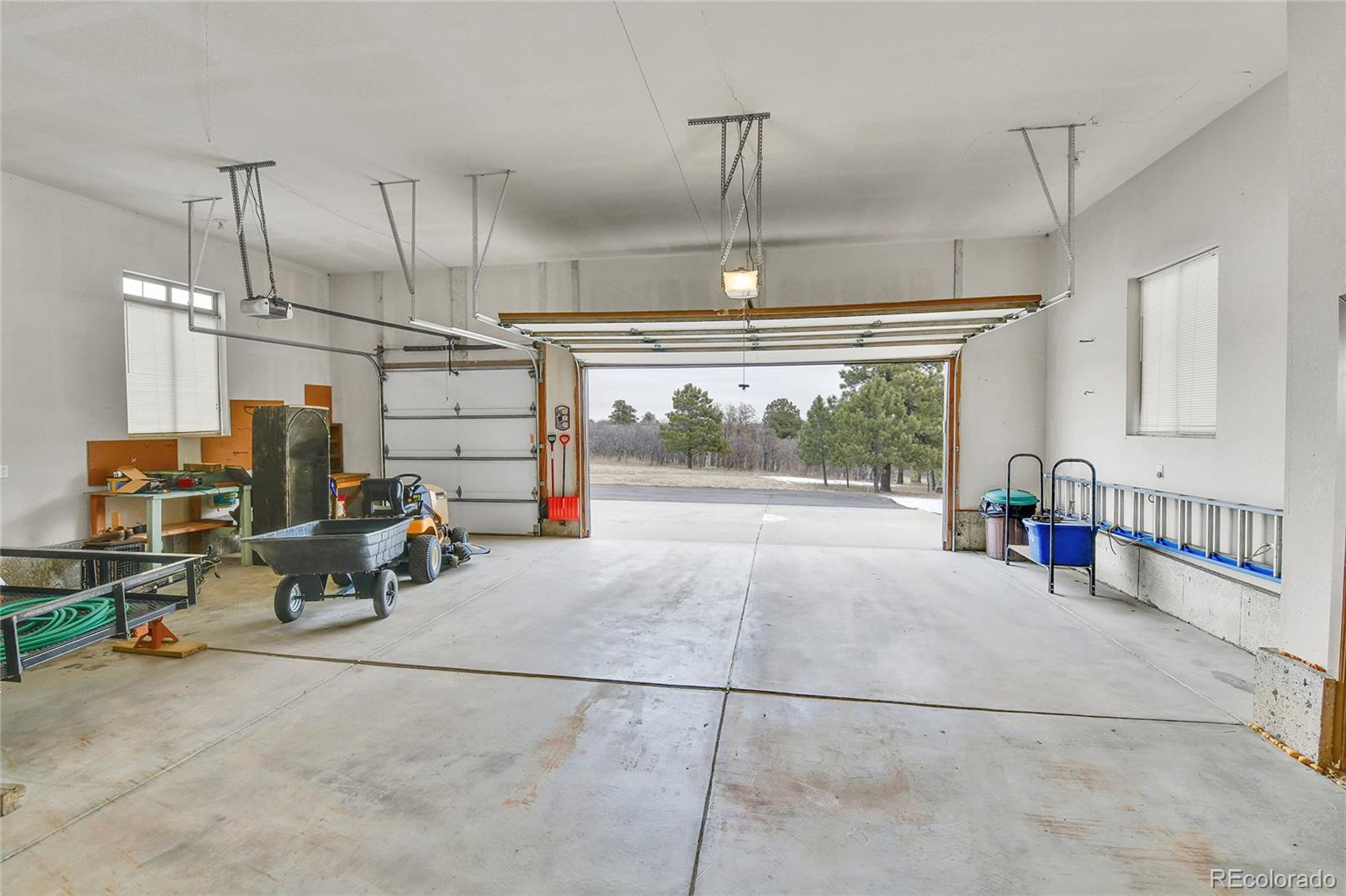 12984 Crowfoot Springs Road Franktown, CO 80116 - Photo 34 of 50 a view of a room with gym equipment
