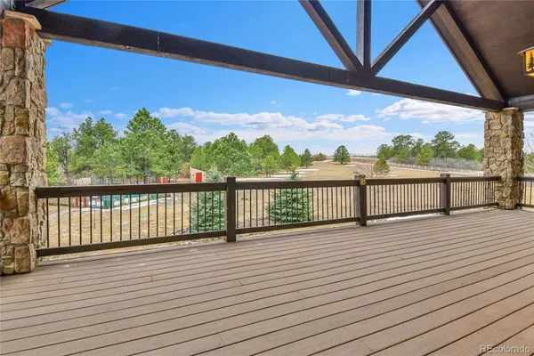 a view of balcony with wooden floor