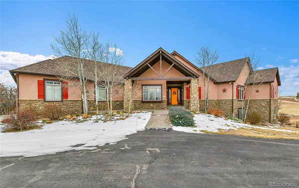 a front view of a house with a outdoor space