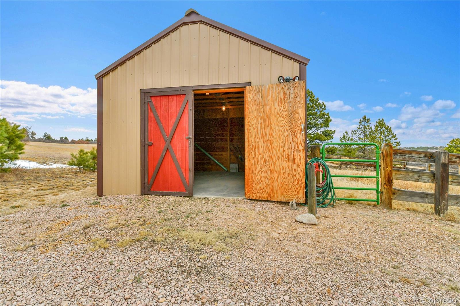12984 Crowfoot Springs Road Franktown, CO 80116 - Photo 43 of 50 a view of a house with a backyard