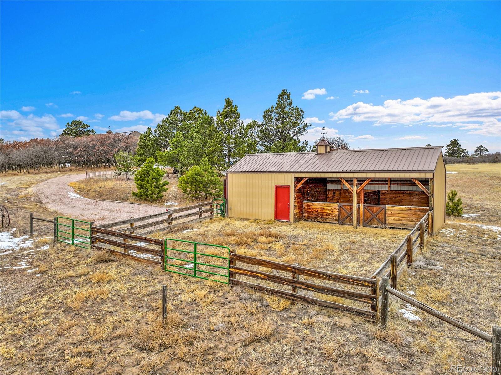 12984 Crowfoot Springs Road Franktown, CO 80116 - Photo 46 of 50 a front view of a house with a yard