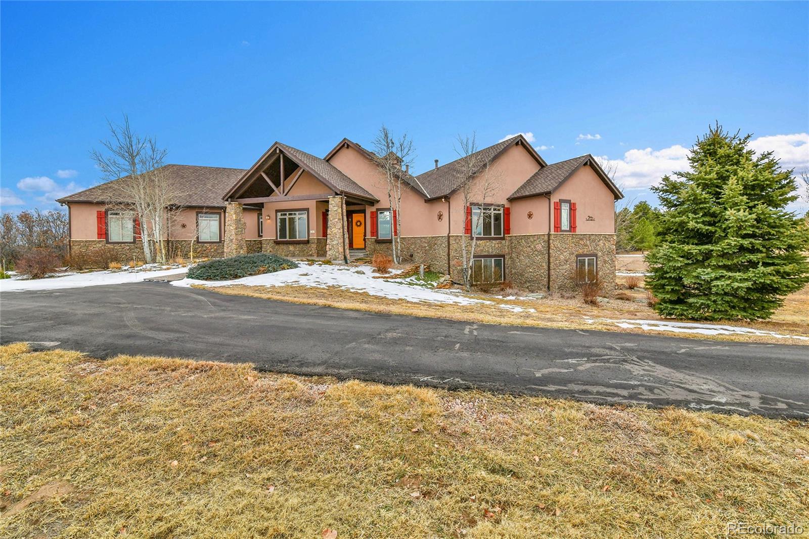 12984 Crowfoot Springs Road Franktown, CO 80116 - Photo 5 of 50 a view of house with a yard and large tree