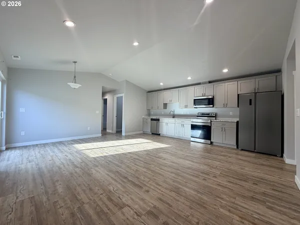 a view of kitchen with wooden floor