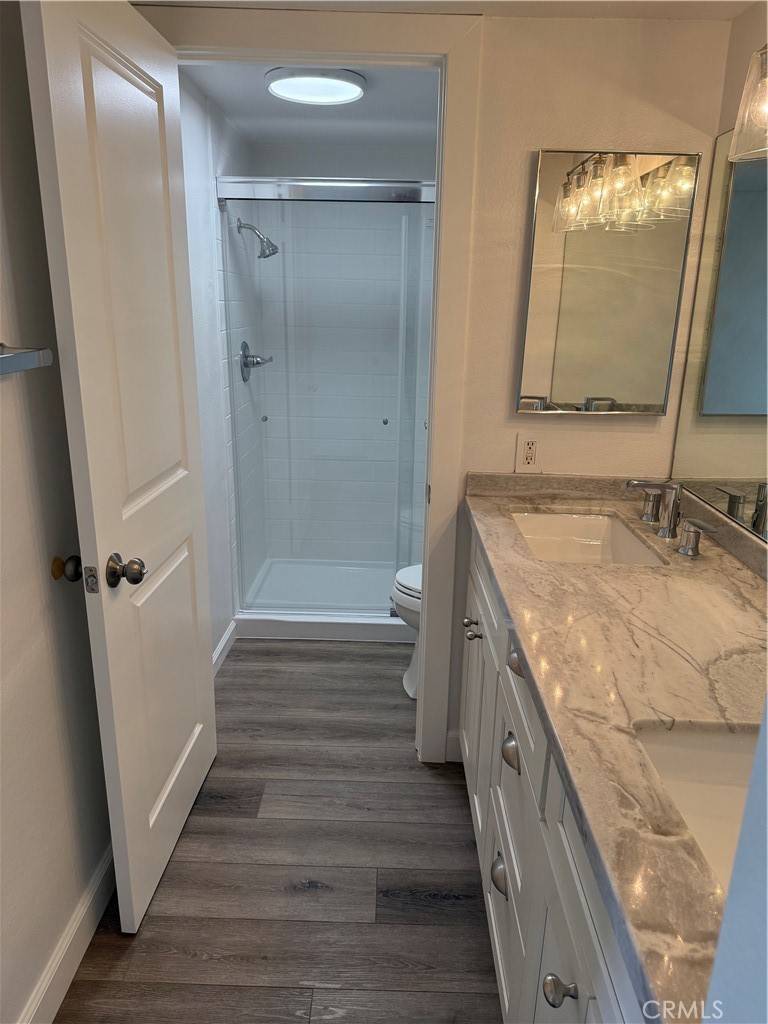 34112 Selva Road, Unit 333 Dana Point, CA 92629 - Photo 9 of 10 a bathroom with a granite countertop double vanity sink and mirror