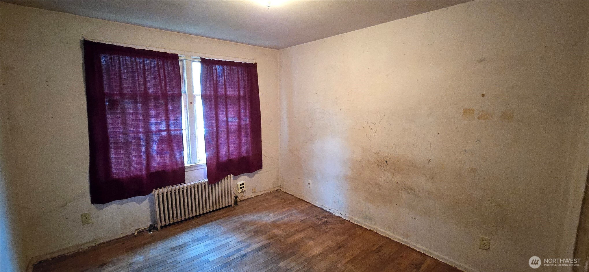 4821 164th Street Southwest Edmonds, WA 98026 - Photo 4 of 11 a view of a room with wooden floor and windows