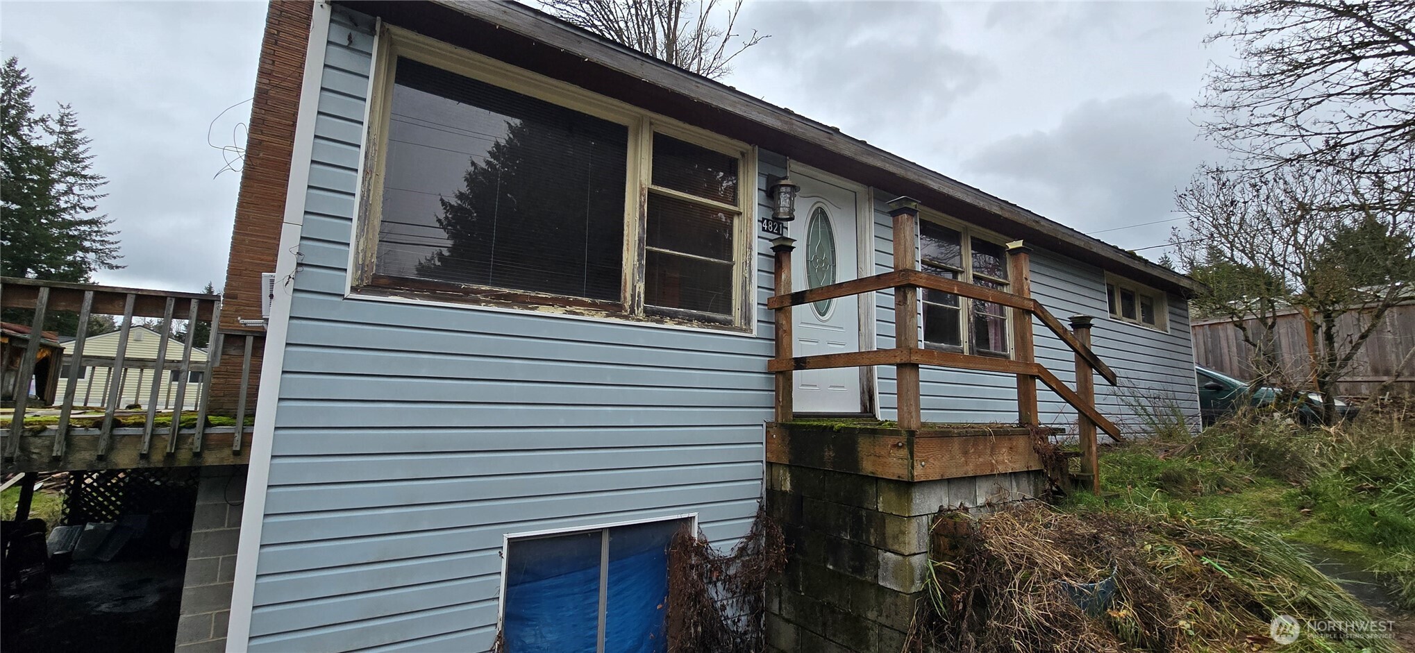 4821 164th Street Southwest Edmonds, WA 98026 - Photo 8 of 11 a front view of a house with balcony