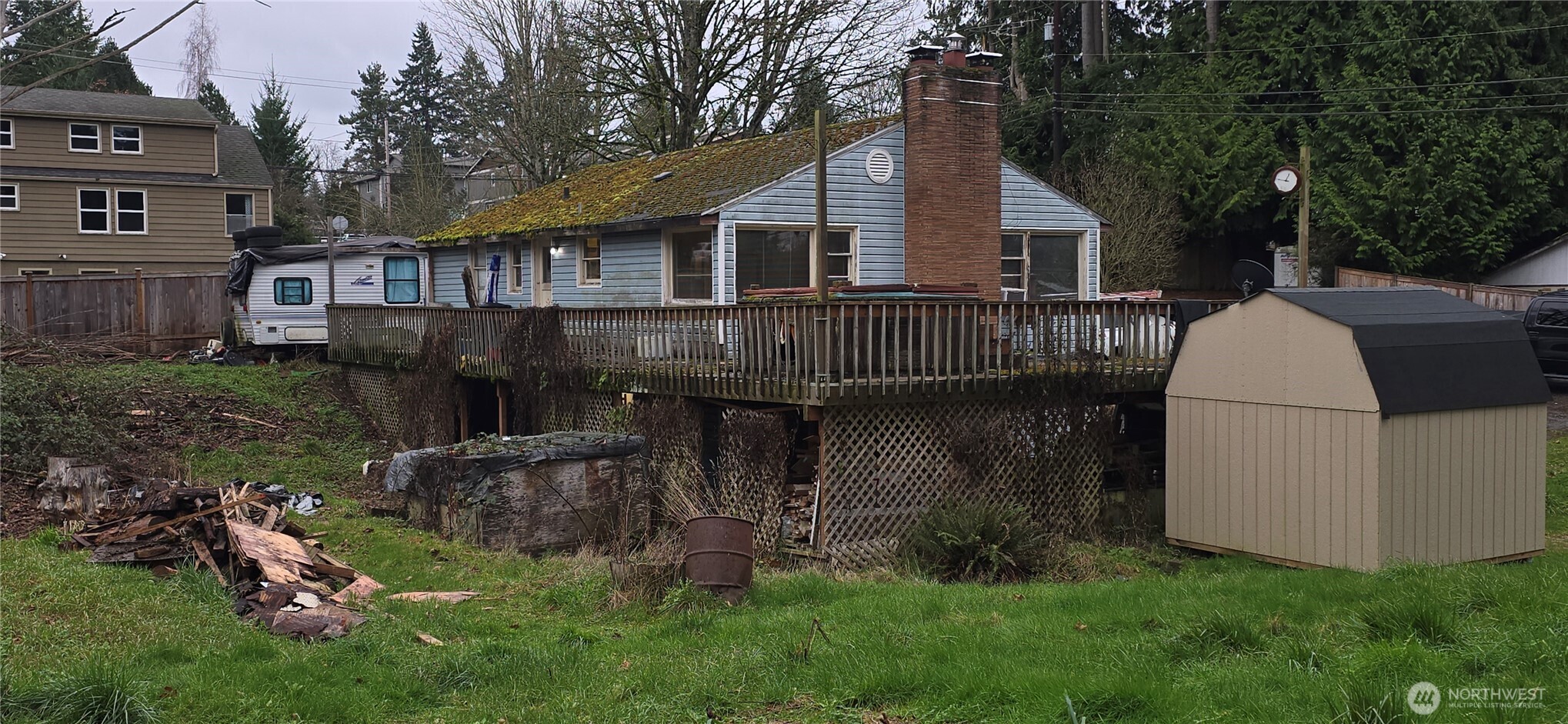 4821 164th Street Southwest Edmonds, WA 98026 - Photo 10 of 11 a view of backyard with table and chairs and potted plants