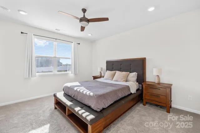 a bed room with a bed and a window