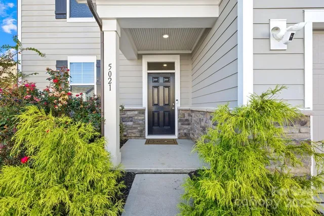 a view of a pathway besides a house