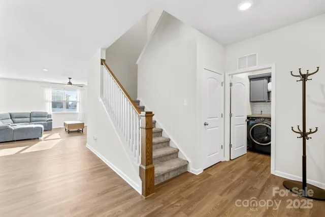 a view of a living room and hardwood floor