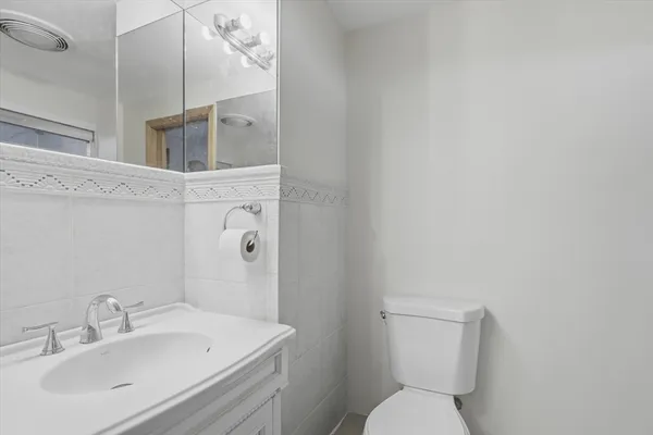 a bath tub sitting next to a shower