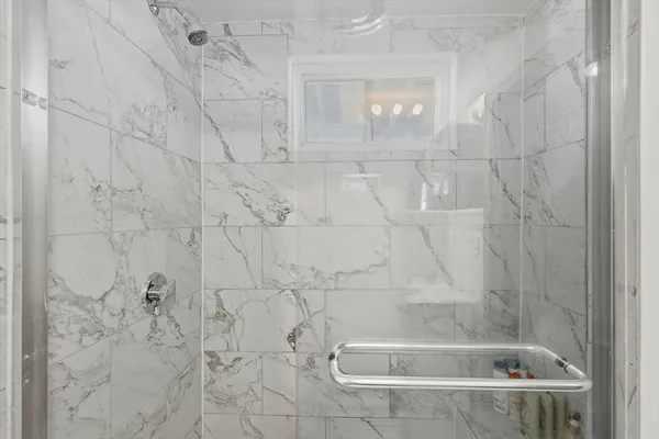 a bathroom with a sink and a shower