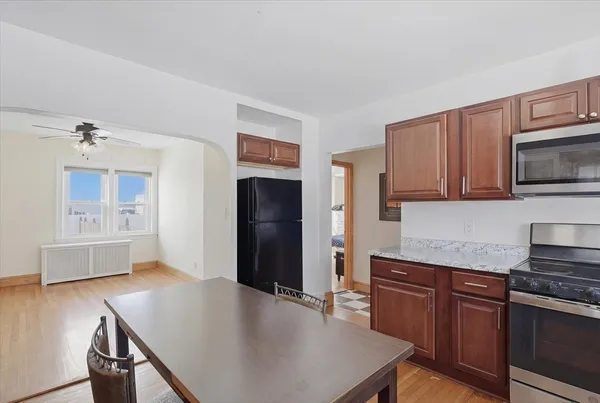 a bedroom with a bed couch and window
