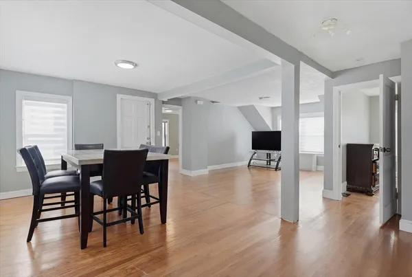 a view of a livingroom with workspace and a window