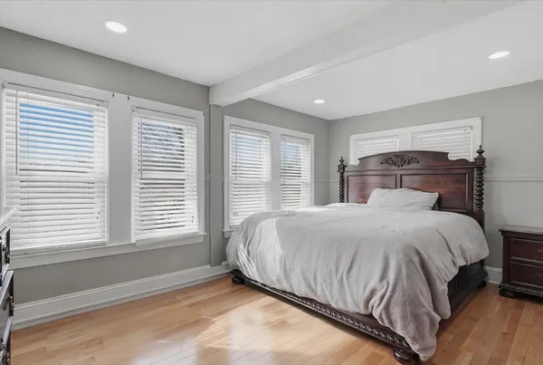 a bedroom with a bed and a fireplace